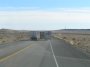 PC215023 Big rigs ahead go three wide on the two lane highway leading to Moab in a chilling preview of what a "NASCAR Big Truck Series" might be like.