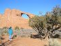 PC225326 Debbie boggles at a high, sturdy-looking arch conveniently located near the road.