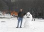 P2266008 Carey teasing a hapless snowman.