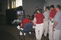 Crowd of future EMS graduates watches and learns