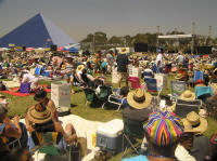 The crowd sprawls out on the grass