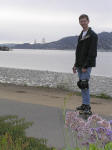 Carey poses with the Golden Gate beyond.