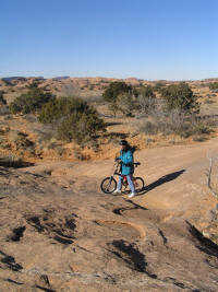 Carey almost did an endo over one of these dips, gaining firsthand experience with one of the shortcomings of the small wheels on these bikes.  Debbie, not a fan of endos, takes it more cautiously.