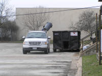 The neighboring building got the dumpster treatment also