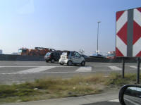 A little Smart car humming down the highway.  Wouldn't stand a chance against a Suburban.