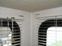 The better part of a day was spent correcting miniblinds like this one to be straight and at consistent heights